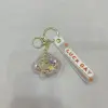 Creative aircraft oil filling keychain, exquisite and cute quicksand floating bottle, schoolbag pendant accessory, car key pendant details Picture